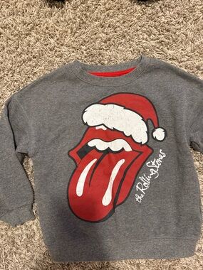 the Rolling Stones Kids Grey Sweatshirt with Red Tongue Santa Graphic